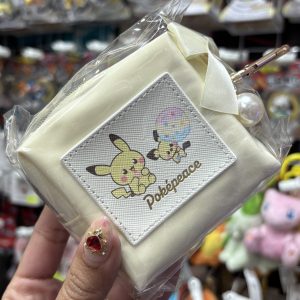THEVOLTAGE.CL POKEMON CENTER ACCESORIOS MONEDERO SATÍN